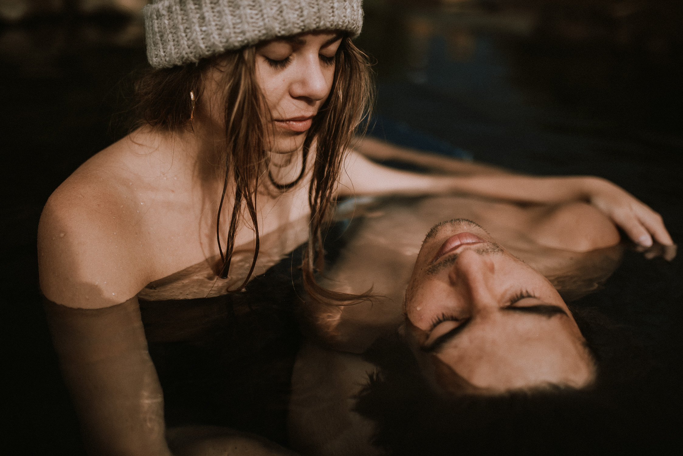 young couple in hot spring iceland